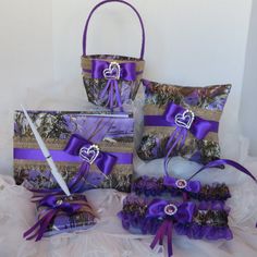 three bags with purple ribbons and bows on them