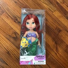 the little mermaid doll is in its packaging