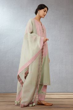 Old rose pink dori embroidered kurta with shell tassel. Paired with embroidered salwar and embroidered dupatta.
Component: 3
Pattern: Embroidered
Type Of Work: Hand Adda and Dori Work
Neckline: Notched
Sleeve Type: Long Sleeves
Fabric: Kurta: Handwoven Chanderi, Cotton Voile; Salwar: Handwoven Chanderi; Dupatta: Silk Organza
Color: Green,Pink
Other Details: 
Tassel detail
Embroidered dupatta
Occasion: Destination Wedding, Wedding - Aza Fashions Dori Work, Embroidered Salwar, Chanderi Dupatta, Types Of Work, Embroidered Dupatta, Luxury Sale, Green Hand, Old Rose, Silk Organza