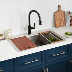 a kitchen sink with a cutting board on the counter