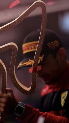 a man is working on an object in the shape of a car's tail