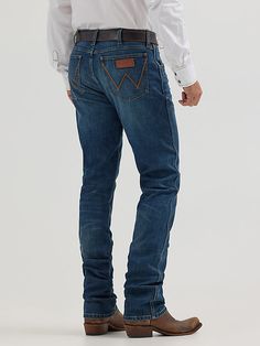 OUR WESTERN ROOTS MADE MODERN Wrangler® Retro® slim fit jeans nod to our history while introducing fits and washes suited for the modern cowboy. Designed with a closer fit and leg opening that still falls comfortably over boots, our men's Wrangler® straight leg slim fit jeans add extra style to the classic look you love. These jeans sit low on the waist and make it easy to show off your favorite belt buckle. That design detail is our Western heritage showing through, something that happens often Cowboy Pants, Modern Cowboy, Straight Leg Jeans Men, Mens Cowboy, Wrangler Jeans, Slim Straight Jeans, Country Style, Belt Buckle, Slim Fit Jeans