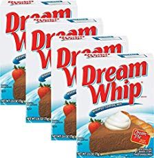 three boxes of dream whip with strawberries and whipped cream