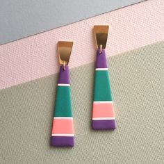 Beautiful and very light pendant earrings, made entirely by hand in polymer clay, mounted with a golden hypoallergenic stainless steel pin. Colors: purple, petrol, pink, white Perfect as a gift and for everyday wear. Being unique and handcrafted earrings, they may have some very small imperfections in shape and texture which do not alter their beauty. Shipping throughout Italy with Posta1. Shipping to Italy and the rest of the world with Postapriority International (no tracking). Geometric Pink Jewelry For Gift, Geometric Pink Jewelry For Gifts, Pink Geometric Jewelry For Gift, Pink Geometric Jewelry For Gifts, Colors Purple, Hand Crafted Gifts, Handcrafted Earrings, Light Pendant, Pendant Earrings