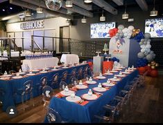 a sports themed birthday party with balloons and tableware set up for a game day celebration