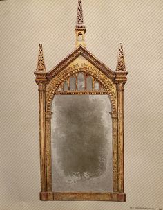 an old mirror is sitting on the wall