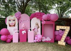 a barbie birthday party with balloons, decorations and decorating for the 7th birthday girl