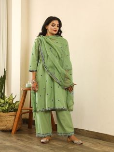 Beautiful handcrafted straight kurta pants set in pure cotton with lovely matching cotton doriya dupatta that is rightly finished with small floral embroidery motifs. Color: Green Fabric: Kurta & Bottom - Cotton Dupatta -Kota Doria Note: Length and sizes can be customised Length - Kurta 40 inches Pants 38 inches Available in other colors If you happen to see some deformity in hand-work or fabric, that’s mere the technique of the same and not a defect. The garment is quite premium. The product wi Green Chanderi Palazzo Set With Floral Embroidery, Green Cotton Silk Anarkali Set With Floral Embroidery, Mulmul Palazzo Set With Zari Work And Straight Kurta, Cotton Anarkali Palazzo Set With Gota Work, Diwali Designer Cotton Sets, Embroidered Palazzo Set With Straight Kurta In Mulmul, Embroidered Mulmul Palazzo Set With Straight Kurta, Pista Green Cotton Silk Palazzo Set With Chikankari Embroidery, Cotton Palazzo Set With Gota Work For Eid