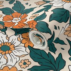 an orange and white flowered wallpaper with green leaves