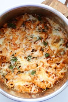 a casserole dish with cheese and vegetables in it