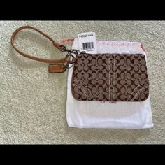 Brand New With Tags! Tan/Brown Signature C Cloth Pattern With Tan Leather Trim. Measurements Shown In Images. Brown Pouch Wristlet For Travel, Brown Wristlet With Zipper Pouch For Daily Use, Everyday Brown Wristlet With Zipper Pouch, Brown Coach Bag With Wrist Strap, Everyday Brown Wristlet With Removable Pouch, Coach Brown Wristlet With Zipper Closure, Brown Coach Wristlet Pouch, Coach Brown Wristlet With Removable Pouch, Brown Coach Wristlet With Removable Pouch