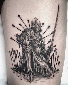 a black and white tattoo of a knight on a horse