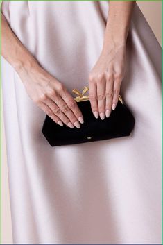 Anya Hindmarch maud tassel clutch in black. 100% Recycled Satin Length: 21‘ Height: 15‘ Depth: 5‘ Made in China Anya Hindmarch Clutch, Classic Evening Pouch Clutch, Timeless Black Evening Bag For Formal Occasions, Chic Black Clutch For Formal Occasions, Chic Black Clutch For Events, Chic Black Evening Bag For Gala, Chic Black Formal Clutch, Black Evening Bag For Gala, Elegant Black Clutch For Gala