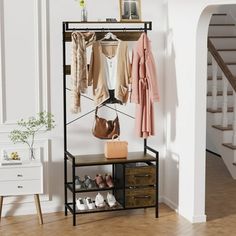 a coat rack with shoes and purses on it in front of a staircase case