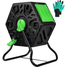 a black and green device with two hands on the handle, attached to a stand