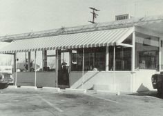 an old black and white photo of a restaurant