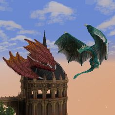 two pixelated dragon statues sitting on top of a building