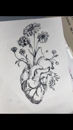 a drawing of a heart with flowers on it