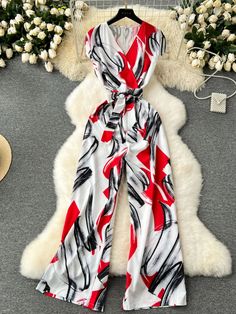 Elegant Red and White Abstract Jumpsuit Outfit Casual Couture, Red Abstract, Print Jumpsuit, Jumpsuit Outfit, Elegant Red, Casual Clothing, Polished Look, Abstract Print, Modern Woman