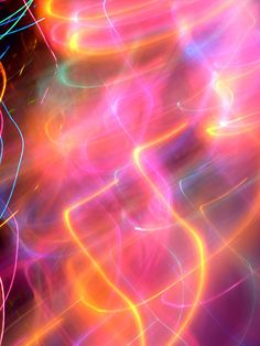 an abstract background with bright lights in the middle and blurry lines at the bottom