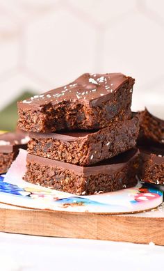 chocolate brownies stacked on top of each other