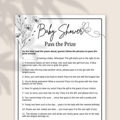 the baby shower pass the prize is in front of a white sheet with flowers on it