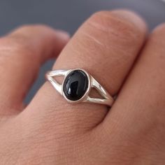 💖  Product Description Dainty Black Onyx Ring - Oval Black Onyx Ring set in 925 Sterling Silver.   Onyx is the 7th Anniversary Gemstone The Black gemstone with the sterling silver contrast makes this a really classy everyday ring 💖 Product Details *  925 Sterling Silver *  Handmade *  Total Ring Length - 8mm *  Stone Size - 7mm x 5mm *. Stone Height - 3mm *  Average Weight - 2.8g *  Band Width - 3mm 💖 Ring Sizing If you're unsure of your finger size, please purchase the reusable plastic ring Black Stone Ring, Boho Jewellery, 7th Anniversary, Everyday Ring, Black Onyx Stone, Black Onyx Ring, Everyday Rings, Onyx Ring, Boho Rings