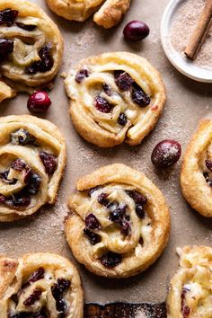 cranberry cinnamon rolls on a baking sheet