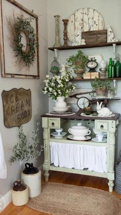 an old fashioned china cabinet is decorated with greenery and other things in the corner