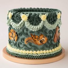 there is a cake decorated with animals on it