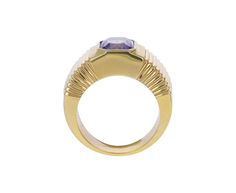 Striking in its intense color and modern design, this Retrouvai ring has a breathtaking presence. The rectangular blue-lavender tanzanite is set vertically and bezel set within the tiered 14K yellow gold polished band. Wear it as a statement making alternative to the traditional cocktail ring. It is a modern classic. tanzanite : 7.5mm x 7mm : 2.41ct14K yellow gold band width : 5mm to 9mmsize available : 6.5please contact us for sizing options Formal Tanzanite Ring With Bezel Setting, Modern Yellow Gold Sapphire Ring For Formal Events, Modern Yellow Gold Sapphire Ring For Formal Occasions, Modern Yellow Gold Tanzanite Jewelry, Modern Yellow Gold Amethyst Ring For Formal Occasions, Modern Tanzanite Rings, Modern Formal Rings With Fluted Bezel, Modern Sapphire Baguette Cut Ring For Formal Occasions, Rectangular Yellow Gold Sapphire Ring For Formal Occasions