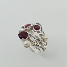 **FREE EXPRESS SHIPPING** Feel the stunning energy in this ring Like I took you for a walk through the fields Solid silver ring with threads and tiny balls coming from different directions Including precious stones , pearls and Ruby in two different cuts And of course you can choose different stones if you like You'll don't want to take it off your finger This ring will fill you with joy and you'll receive full of compliments Materials: Sterling silver Ruby Pearl Silver Weight: 6.2 Can be ordere Silver Multi-stone Pearl Ring, Bohemian Sterling Silver Ruby Ring, Handmade Unique Sterling Silver Pearl Ring, Bohemian Sterling Silver Ruby Ring For Anniversary, Ruby Silver Ring, Pearl Birthstone, Ring Pearl, Garnet Ring, Ring Promise