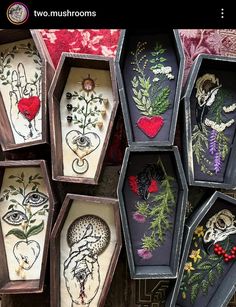 there are many small boxes with different designs on the inside one is filled with flowers and hearts