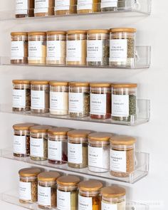 the shelves are filled with spices and seasonings