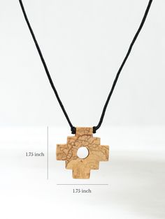 Distinct fragrance of wood sustainably harvested from the Palo Santo tree. Solid wood chakana cross dangles from a round black cord adjustable with sliding knots for the length you want. Measures 1.75" x 1.75" Black 24" adjustable cord Adjustable Brown Cross Pendant Necklace, Adjustable Natural Wood Spiritual Jewelry, Adjustable Cross Pendant Jewelry, Adjustable Natural Wood Traditional Jewelry, Adjustable Traditional Natural Wood Jewelry, Adjustable Cross Necklace With Cord, Adjustable Artisan Natural Wood Necklace, Adjustable Wooden Beads Cross Jewelry, Adjustable Cross Jewelry With Wooden Beads