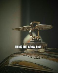 an image of a car emblem with the words think and grow rich