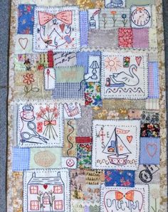 a patchwork quilt with many different designs on it