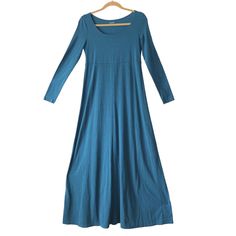 This Cute And Modest Garnet Hill Maxi Dress Is Perfect For Any Casual Occasion. With Its Beautiful Teal Blue Color And Solid Pattern, It Is Sure To Make You Stand Out In A Crowd. The Dress Features Long Sleeves, A Round Neckline, And A Pullover Closure For Easy Wear. Pit To Pit 16.75in Waist 15in Length 56in Sleeve Length 23in Made From A Comfortable Blend Of Spandex, Rayon, And Cotton, This Jersey Fabric Dress Is Perfect For Summer, Fall, And Spring. Its Empire Waist Design Adds A Touch Of Eleg Blue Long Maxi Dress For Fall, Blue A-line Maxi Dress For Fall, Casual Long Blue Maxi Dress, Fitted Blue Maxi Dress With Long Sleeves, Casual Blue Maxi Dress, Blue Flowy Long Midi Dress, Flowy Blue Long Midi Dress, Casual Long Blue Midi Dress, Blue Stretch Maxi Dress For Fall