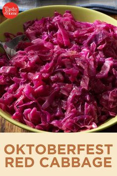 a bowl filled with red cabbage on top of a wooden table