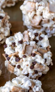 chocolate chip cookies with marshmallows and chocolate chips in them on a baking sheet