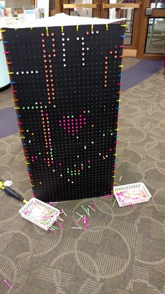 a large display with many different colored dots on it