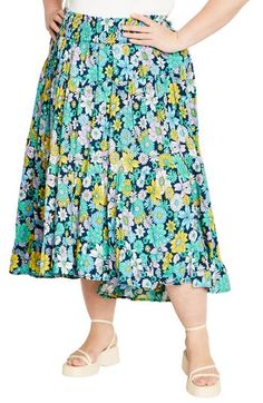 A captivating print and ankle-grazing hem add eye-catching elements to a flowy skirt fitted with a smocked waist for comfortable wear. 38 1/2" length Smocked waist 100% viscose Machine wash, line dry Imported Floral Print Flowy Skirt, Vacation Floral Print Full Skirt Bottoms, Flowy Floral Print Skirted Bottoms, Floral Print Full Skirt Bottoms For Vacation, Beach Skirted Rayon Bottoms, Floral Print Full Skirt For Vacation, Spring Ruffled Rayon Skirt, Bohemian Midi-length Spring Bottoms, Bohemian Midi Length Spring Bottoms