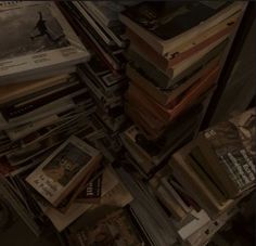 many books are stacked on top of each other