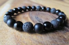 Black Onyx, Lava and Matte Black Onyx Beaded Bracelet for Men, 6mm or 8mm Adjustable Black Lava Stone Bracelet, Black Lava Stone Bracelets With Gemstone Beads, Black Lava Stone Bracelet With Gemstone Beads, Black Lava Stone Beaded Bracelets, Black Lava Stone Spiritual Beaded Bracelets, Black Lava Stone Bracelet Jewelry, Black Lava Stone Jewelry With Round Beads, Elegant Black Lava Stone Jewelry, Black Lava Stone Beaded Bracelets With Natural Stones