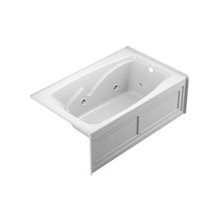 a white bath tub sitting on top of a counter