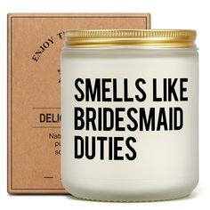 a white candle with the words smells like bridesmaid duties in black on it