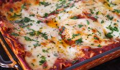 a casserole dish with cheese and herbs