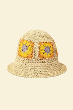 a straw hat with sunflowers on the front and yellow flowers on the side