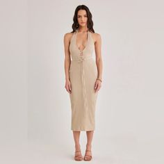 Simple Halter Midi With Tie Front & Plunging Neckline. Zip Closure & Split At Back Hem. Crafted In A Soft Crinkle Knit Fabric, Fully Lined Beige Backless Midi Dress For Brunch, Beige Halter Neck Midi Dress For Date Night, Midi Plunge Dress, Tie Strap Dress, White Floral Midi Dress, Gingham Jacket, Plunge Dress, Bow Detail Dress, V Neck Midi Dress