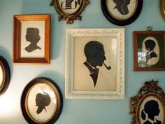 many framed silhouettes are on the wall